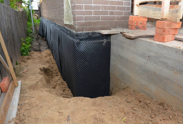 SJ Waterproofing Pros technician performing targeted Sump Pump Installation assessment in Hines, OR